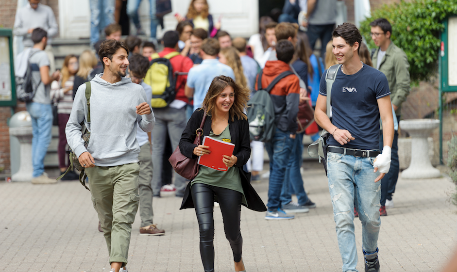 Three ESCP students coming out of a campus