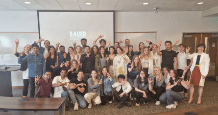 A group of ESCP students taking a photo in a classroom